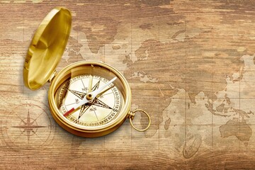Classic round old compass on background