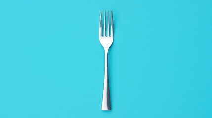 A silver fork centered on a bright turquoise background.