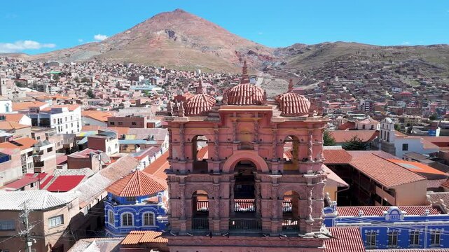 Aerial of Bell Tower with Cerro Rico behind in Potos&iacute;, Orbit