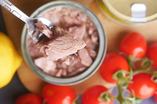 canned tuna on wooden table ,