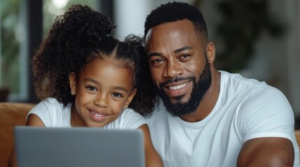 Fototapeta premium Loving father embracing his smiling young daughter on a couch in a heartwarming family portrait The two are sharing a tender moment of affection and togetherness