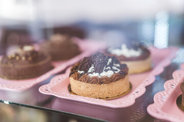 Sweet dessert: Tarts, Tartlets. Chocolate pastry baskets filled with nuts, caramel,and coffee cream