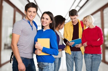 Portrait of happy smiling students friends in international university.