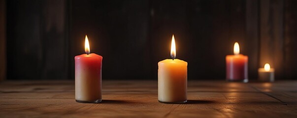 Single candle burning on a wooden table in a dark room, shadows, glow, ambiance
