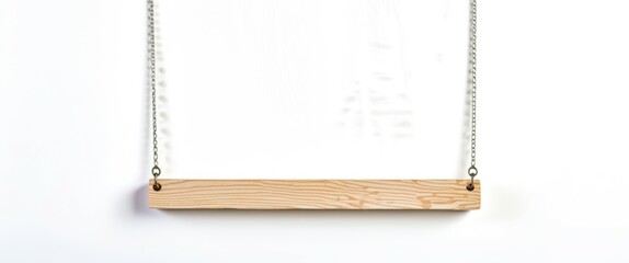 Fototapeta premium Photograph of a wooden swing hanging from two chains, centered in the frame, with a plain white background. The swing is rectangular with a smooth, light brown finish, and the chains are silver and me