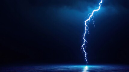A dramatic lightning strike illuminates a dark, stormy sky over water.