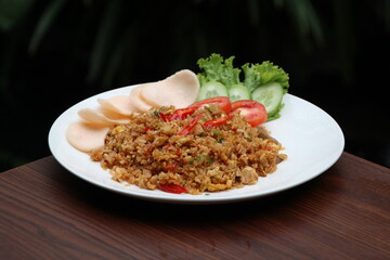 fried rice with chicken and crackers on white plate ceramic