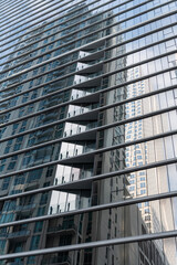 Obraz premium Building background. Glass building window. Architectural detail. Background of architecture. Modern glass background. Glass exterior background. Business district. Building exterior architecture