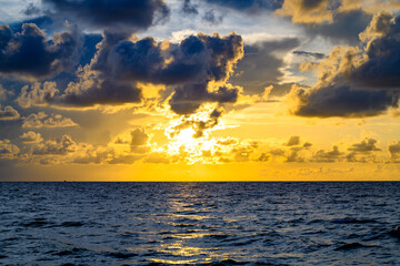 Dramatic sky and sun rays. Stormy cloud sky. Clouds above ocean. Dark cloudy sky at sunset background. Cloud sky with sea background.