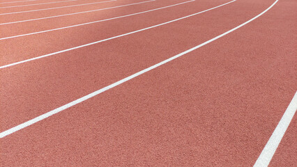 Fototapeta premium Race running track in stadium with white lines