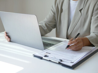 Businesswoman employer holding resume, recruiting, planning, evaluating and reviewing resume of job applicant, recruiting new employees, recruitment concept