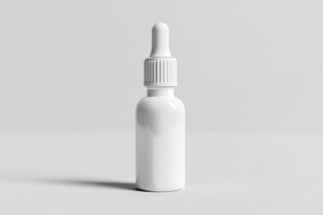 White dropper bottle on white background.