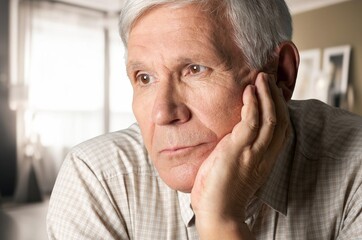 Elderly old sad man thinking of memory