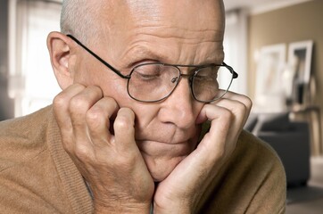 Elderly old sad man thinking of memory