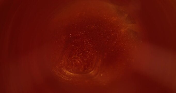 Sparks swirl. Blurred shimmering dust. Red orange color smoke cloud shiny particles water texture paint ink on dark black abstract art background. - Powered by Adobe