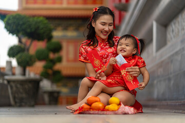 Joyful Mother and daughter on Chinese New Year Celebration