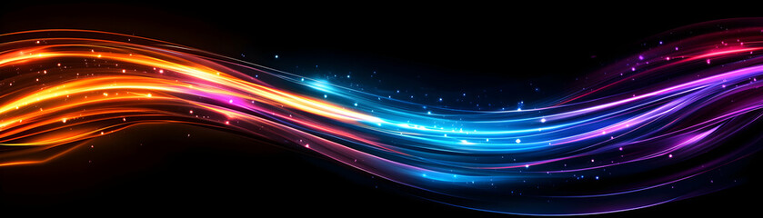 Fototapeta premium Vibrant glowing waves of color on a dark background, perfect for digital designs.