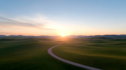 Serene landscape showcasing rolling hills under a vibrant sunrise sky.