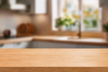 Kitchen wood table top for product display with blurred modern interior. Wooden tabletop over defocused kitchen background. kitchen furniture and desk space. product promotion in the kitchen