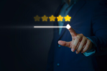 Businessman hand touches two stars from five rating feedback on virtual screen.