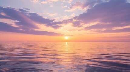 Fototapeta premium Sunset over calm ocean with dramatic clouds