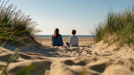 Fototapeta premium Romantic couple sitting on the sand, enjoying a sunny day at the beach