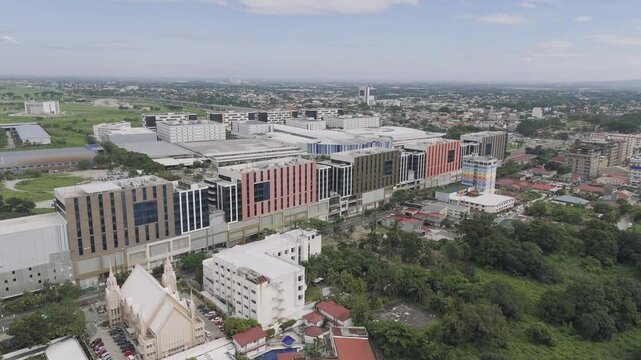 Drone spins, view of Angeles city, SM City Clark, Mount Arayat