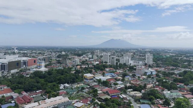 Fly over Angeles City towards Mount Arayat, the Philippines