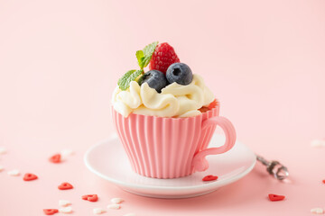 Homemade cupcakes with whipped cream garnished fresh berries for Holidays