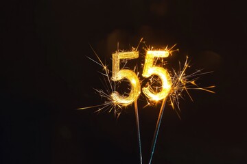 Minimalist Celebration with Glowing Sparkler Shaped as Number 55