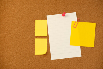 Blank sticky note paper on cork board wall. Noticeboard to organize life and work concept