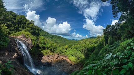 A wide-angle view of Thailand stunning forest waterfall, surrounded by lush jungle greenery. A serene landscape ideal for nature travel or environmental campaigns.