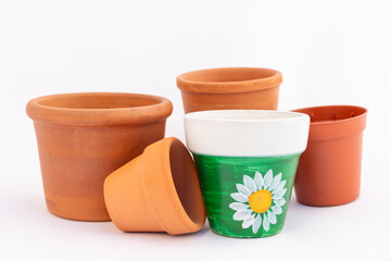 Set of empty small miniature clay flower pots isolated on white background