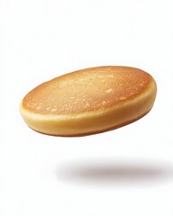 A floating pancake showcasing its golden-brown surface and fluffy texture.