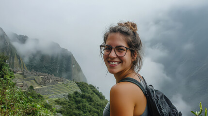 Naklejka premium Smiling woman Machu PicchuPeruwomantravelerhappymountaincloudsmistancient