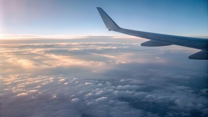 Obraz premium Wide-angle airplane wing soaring above clouds for travel branding and ads 