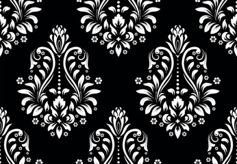 Floral pattern. Vintage wallpaper in the Baroque style. Seamless vector background. White and black ornament for fabric, wallpaper, packaging. Ornate Damask flower ornament.
