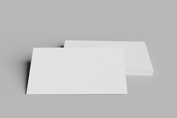 Business Cards or Name Cards textured in white and isolated on a grey surface background. 3d rendered illustration and graphic asset