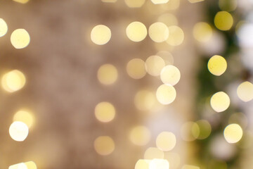 Obraz premium A blurry image of a lighted room with a wall in the background