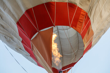 A hot air balloon with a flame on it