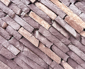 A brick wall with a brown and tan color