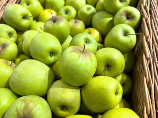 A basket full of green apples