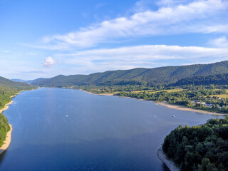 View of the stretching lake, trees, nature, forest.
