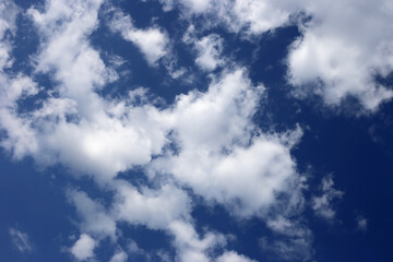 White fluffy clouds in blue sky