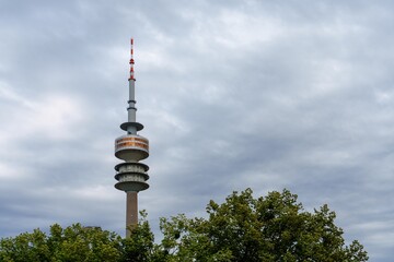 Fototapeta premium The Olympic Tower in Munich, Germany, is a 291-meter-tall telecommunications tower built for the 1972 Summer Olympics. It offers stunning views of the city and the surrounding area.