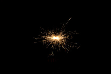 Burning bengal sparks isolated on black background