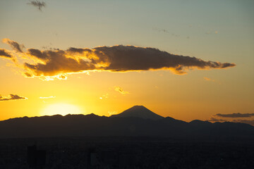 The silhouette of Mount Fuji as seen from central Tokyo