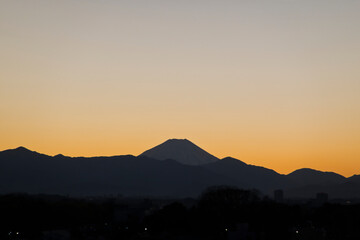 The silhouette of Mount Fuji as seen from central Tokyo