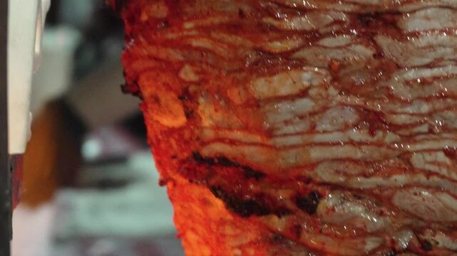 Close up al pastor sizzling as it get cooked 