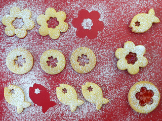 Linzer cookies on red background. Christmas baking